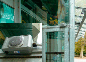 Photo of a device to provide audio signals above a door with a close-up in an inset photo